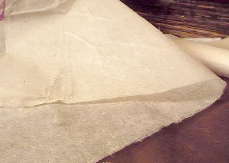 Making lokta string from handmade lokta tissue paper
