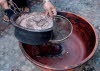 Straining walnut husks
