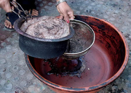 Straining walnut husks